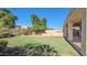Lush backyard with green grass and built in BBQ at 4730 N 111Th Ln, Phoenix, AZ 85037