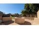 Backyard featuring a fire pit and built in BBQ at 4730 N 111Th Ln, Phoenix, AZ 85037