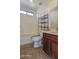 Bathroom with tile floors, toilet, shower and a dark-wood vanity at 4730 N 111Th Ln, Phoenix, AZ 85037