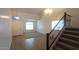 Spacious entryway featuring a staircase and neutral decor at 4730 N 111Th Ln, Phoenix, AZ 85037