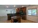 Eat in kitchen with stainless steel appliances and an island at 4730 N 111Th Ln, Phoenix, AZ 85037