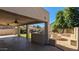 Large covered patio with a BBQ and a fire pit in the backyard at 4730 N 111Th Ln, Phoenix, AZ 85037