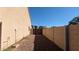 Side yard with block fencing and gate leading to backyard at 4730 N 111Th Ln, Phoenix, AZ 85037