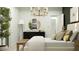 Chic bedroom boasts a round mirror, dark dresser, and a tall indoor plant for a touch of nature at 4732 E Amethyst Ln, San Tan Valley, AZ 85143