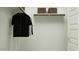 Organized closet with hanging clothes and shelving perfect for the new homeowner at 4732 E Amethyst Ln, San Tan Valley, AZ 85143