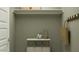 Practical mud room with storage options for organization with shelving, hooks, and storage bins at 4732 E Amethyst Ln, San Tan Valley, AZ 85143