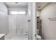 Clean bathroom featuring a tub with shower and built-in shelving at 4948 W Wikieup Ln, Glendale, AZ 85308