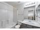 Spotless bathroom features a white tub, shower, toilet, and sink with vanity at 4948 W Wikieup Ln, Glendale, AZ 85308