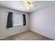 Bedroom includes carpet floors, neutral walls, ceiling fan and a big window at 4948 W Wikieup Ln, Glendale, AZ 85308