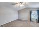 Large bedroom featuring vaulted ceilings and a window with curtains at 4948 W Wikieup Ln, Glendale, AZ 85308
