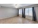 Cozy bedroom with a ceiling fan, large windows and neutral decor, perfect for relaxation at 4948 W Wikieup Ln, Glendale, AZ 85308