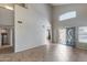 Bright, airy living room with high ceilings, large windows, and tile flooring, creating a welcoming atmosphere at 4948 W Wikieup Ln, Glendale, AZ 85308