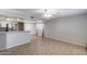 Open living area with tile floors and a view into the kitchen, great for entertaining guests at 4948 W Wikieup Ln, Glendale, AZ 85308