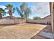 Expansive backyard with potential for landscaping, featuring a shaded seating area at 537 W Kingman Dr, Casa Grande, AZ 85122