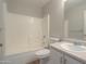 Bathroom features a shower-tub combo and vanity at 537 W Kingman Dr, Casa Grande, AZ 85122