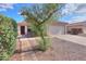 Charming single-story home featuring a well-maintained yard and a two-car garage at 537 W Kingman Dr, Casa Grande, AZ 85122
