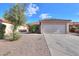 Charming single-story home featuring a well-maintained yard and a two-car garage at 537 W Kingman Dr, Casa Grande, AZ 85122