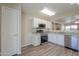 Bright kitchen features stainless steel appliances, granite countertops, and modern white cabinetry at 537 W Kingman Dr, Casa Grande, AZ 85122