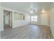 Bright and open living room featuring modern flooring, lots of light and neutral paint at 537 W Kingman Dr, Casa Grande, AZ 85122