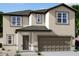 Charming two-story home featuring a neutral color palette, complemented by a spacious two-car garage and well-manicured landscaping at 6008 E Artemis Dr, Florence, AZ 85132