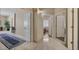 Hallway featuring marble floors and white doors leading to various rooms in the home at 7418 E Black Rock Rd, Scottsdale, AZ 85255