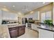 Well-equipped kitchen featuring white cabinets, granite countertops, and stainless steel appliances at 7418 E Black Rock Rd, Scottsdale, AZ 85255