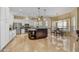 Bright and open kitchen with a large island, stainless steel appliances, and white cabinetry at 7418 E Black Rock Rd, Scottsdale, AZ 85255