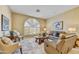 Comfortable living room with plush seating, a decorative window, and a patterned rug at 7418 E Black Rock Rd, Scottsdale, AZ 85255