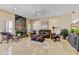 Spacious living room with a decorative fireplace, comfortable seating, and natural light from the window at 7418 E Black Rock Rd, Scottsdale, AZ 85255