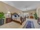 Spacious main bedroom showcasing a decorative wood bed frame, sitting area and lush greenery at 7418 E Black Rock Rd, Scottsdale, AZ 85255