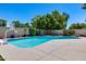 A well-maintained pool with hardscape surrounds for easy maintenance and leisure at 7435 W Trails Dr, Glendale, AZ 85308