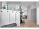 Inviting entryway featuring a coat rack with decor and neutral tones, seamlessly flowing into the living spaces at 7435 W Trails Dr, Glendale, AZ 85308