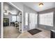 Bright foyer features tile flooring, and ample natural light, leading to the rest of the home at 7435 W Trails Dr, Glendale, AZ 85308