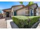 Inviting home exterior featuring desert landscaping, with a quaint front entrance and walkway at 7435 W Trails Dr, Glendale, AZ 85308