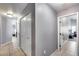 Neutral hallway with tiled flooring and white doors provides access to various rooms at 7435 W Trails Dr, Glendale, AZ 85308