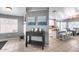 Cozy living area with a view of the kitchen, showcasing a stylish console table and neutral décor at 7435 W Trails Dr, Glendale, AZ 85308