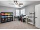 Spacious home office with bright lighting, carpet flooring, and ample space for work or study at 7435 W Trails Dr, Glendale, AZ 85308