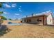 Expansive backyard with pool, patio, and green space, providing ample room for outdoor relaxation and entertainment at 7526 W Windrose Dr, Peoria, AZ 85381