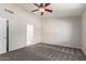 Cozy bedroom featuring neutral paint, carpet and fan at 7526 W Windrose Dr, Peoria, AZ 85381