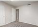 Bedroom featuring plush carpets, neutral walls, closet space and open entry at 7526 W Windrose Dr, Peoria, AZ 85381
