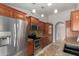 Spacious kitchen with stainless steel appliances, granite countertops, and tile backsplash at 7526 W Windrose Dr, Peoria, AZ 85381
