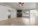 Inviting living room showcases tile flooring, a fireplace, and views of the backyard pool at 7526 W Windrose Dr, Peoria, AZ 85381