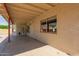 Covered patio area offering a seamless transition between indoor and outdoor living with a view of the backyard at 7526 W Windrose Dr, Peoria, AZ 85381