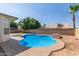 Lush backyard featuring a sparkling pool, inviting spa, and ample space for outdoor activities and enjoyment at 7526 W Windrose Dr, Peoria, AZ 85381