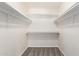 Spacious walk-in closet with carpet and shelving for organization at 7526 W Windrose Dr, Peoria, AZ 85381