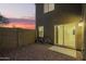Charming backyard with gravel, fence and sliding glass door to the house at 8253 W Illini St, Phoenix, AZ 85043