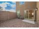 Gravel backyard with privacy wall and open view to the sky above at 8253 W Illini St, Phoenix, AZ 85043