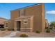 Attractive home exterior featuring desert landscaping, a tiled roof, and neutral colors at 8253 W Illini St, Phoenix, AZ 85043