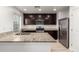 Well-equipped kitchen featuring stainless steel appliances, granite countertops, and ample cabinet space at 8253 W Illini St, Phoenix, AZ 85043