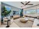 Comfortable living room with plush seating, modern decor, and abundant natural light at 8258 E Petunia Ave, Mesa, AZ 85212